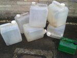 this is a photo of some twenty litre plastic cubies for collecting old chip oil